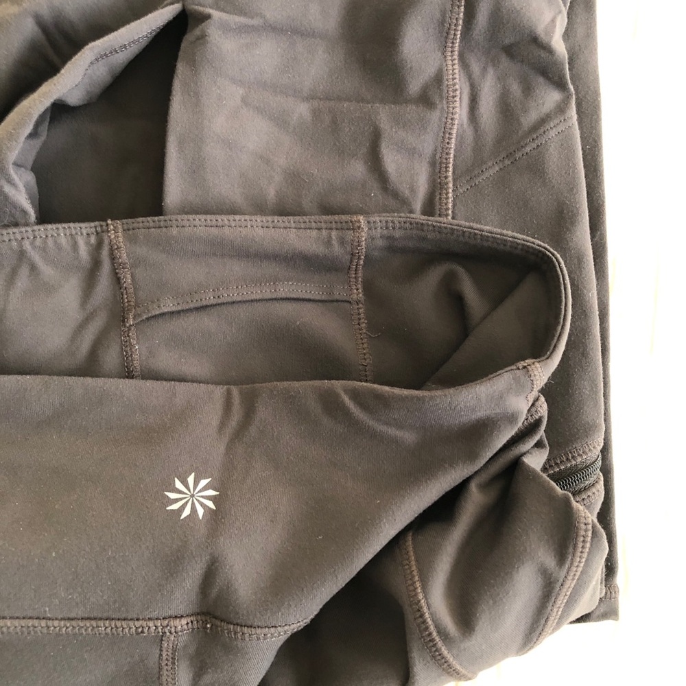 ATHLETA high waist leggings in brown with zip pockets. Size M.